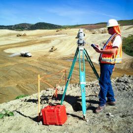 Survey employee taking measurements